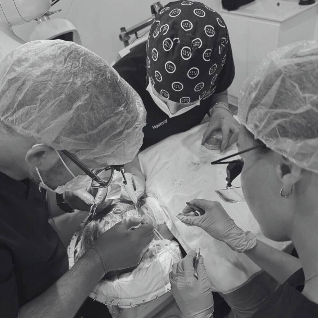 Surgeons using ARTAS robot during a hair transplant operation in Noosa