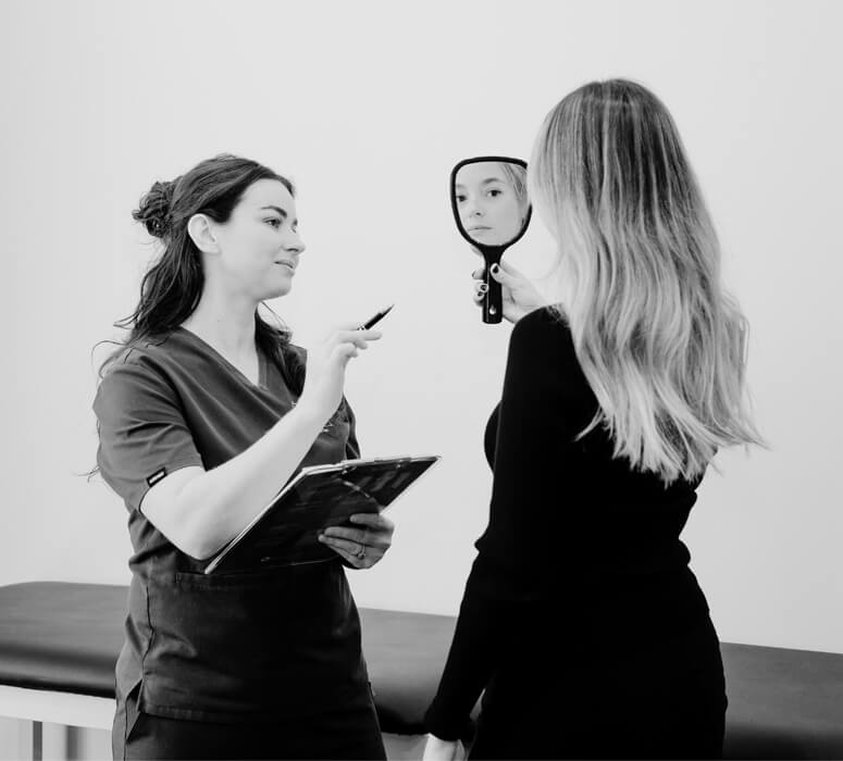 woman looking at her reduced wrinkles after a skin peel