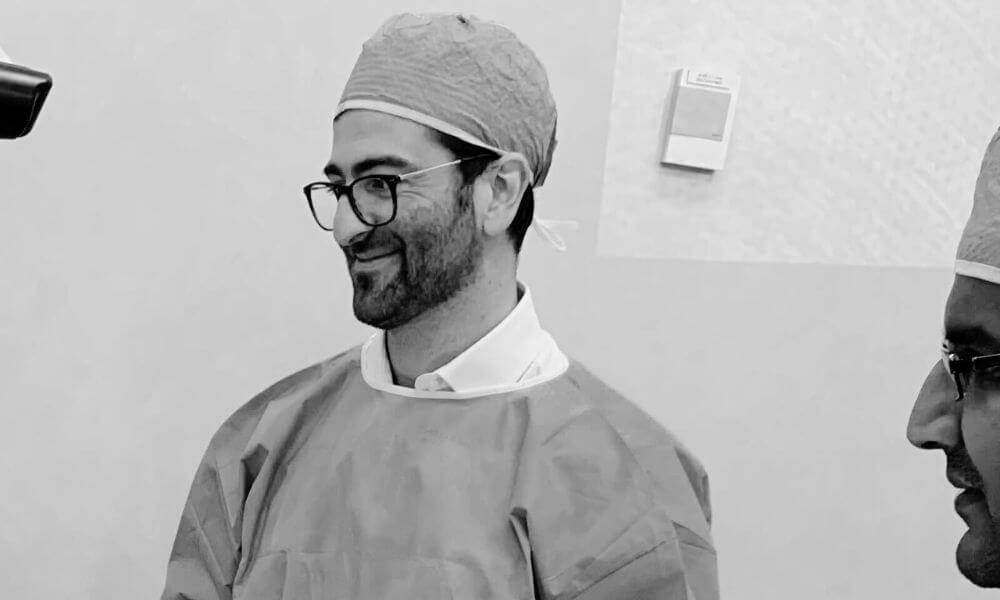 Hand surgeon looking at a patient's damaged hand